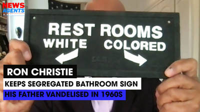 The News Agents USA: Ron Christie shows segregated toilet sign his father valdalised in the 1960s image