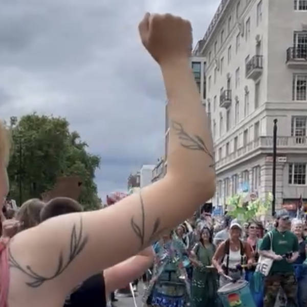 Dyke March greets Restore Nature Now March in solidarity as they pass each other in central London, UK on 22nd June 2024 – by Laura Hurley