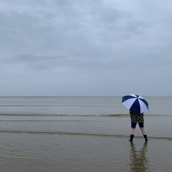 Rain on the sea, Camber Sands, East Sussex, UK on 23rd May 2022 – by Sam Clements and Louise Owen